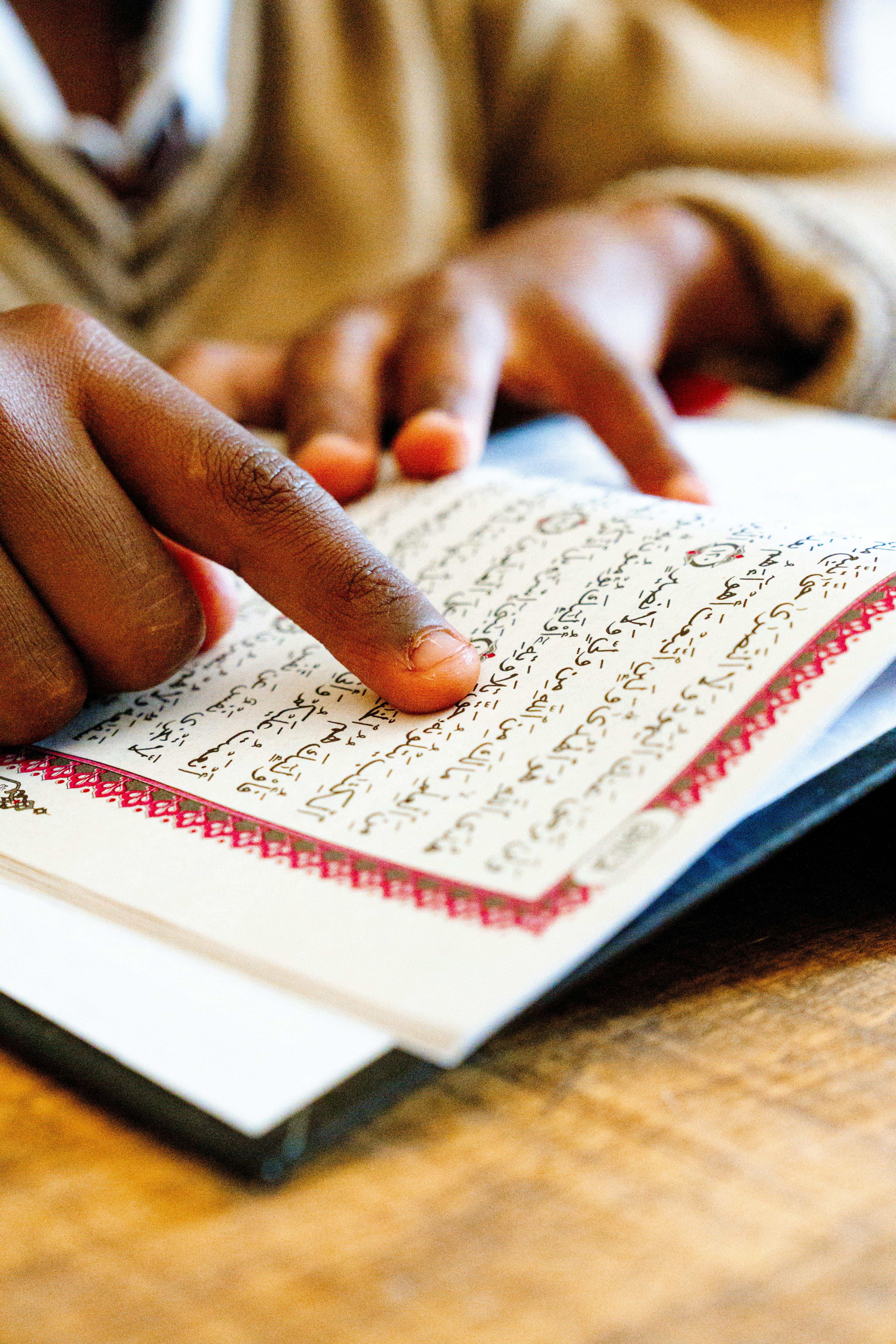 Muslim kid reading Quran (UHOM)
